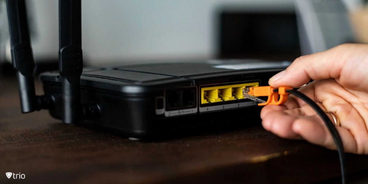 A cable being plugged into a router