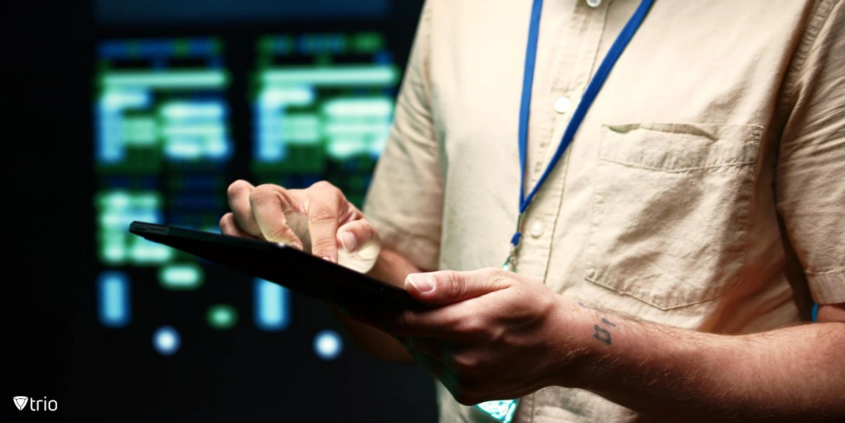 IT admin using a mobile device in a server room