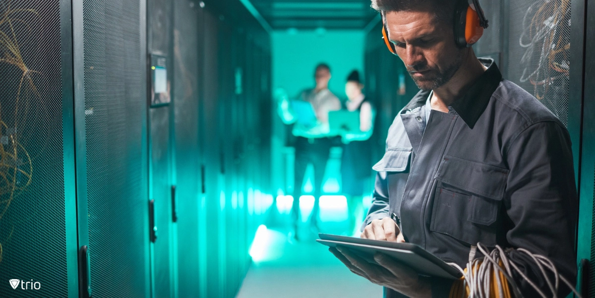 Technician read for server hardware management standing in server room