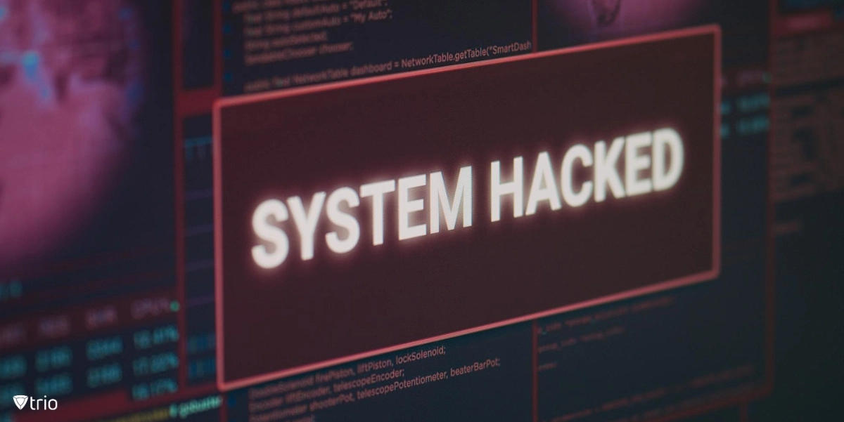 Computer monitor showing hacked system alert message flashing on screen