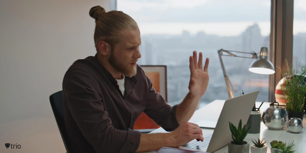 man using zero-touch automation capabilities in his home office on his laptop