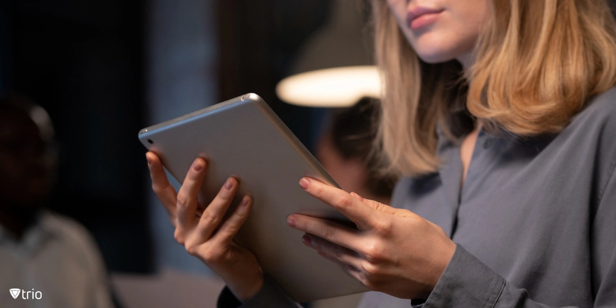 Female employee uses iPad configured with Single App Mode