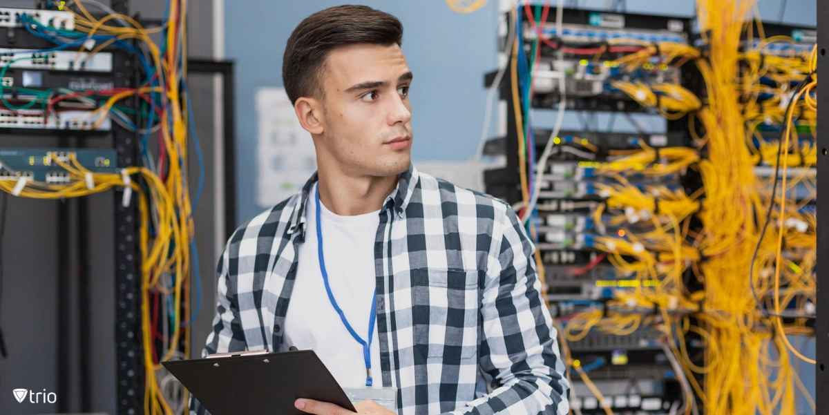 Young engineer in server room