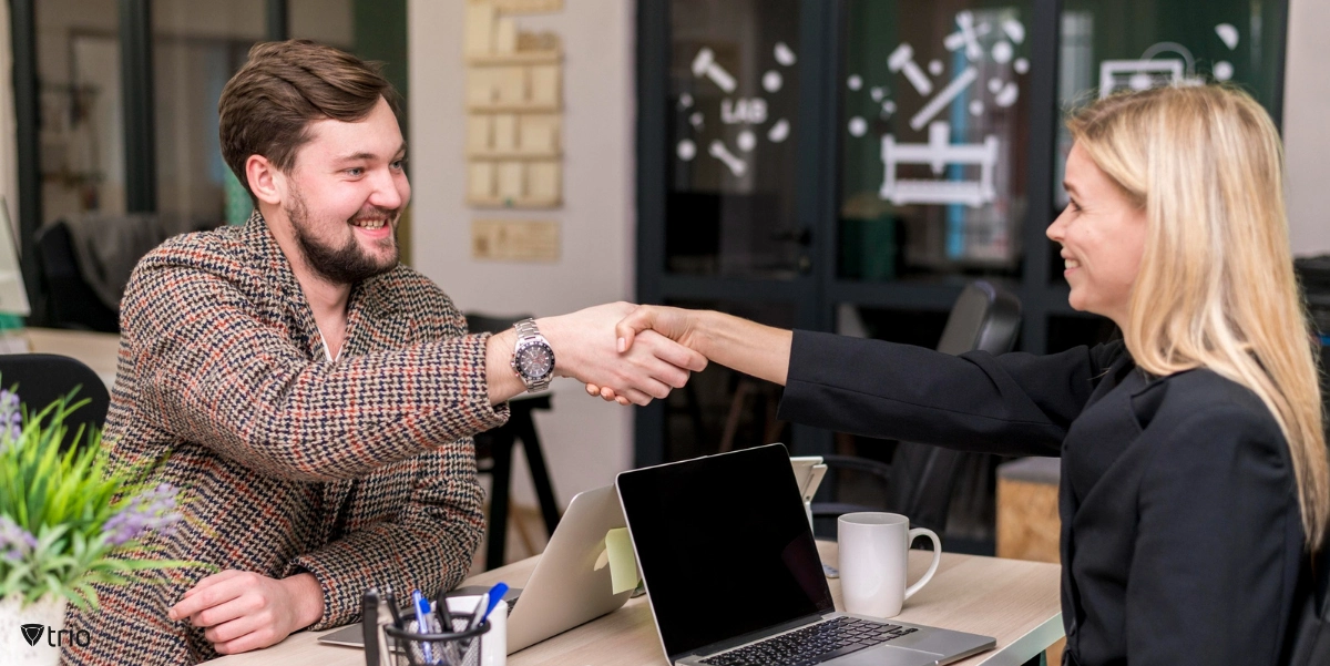 HR shaking hands with an employee