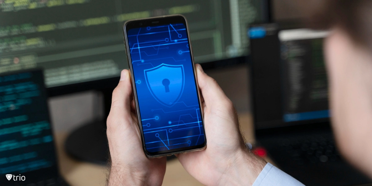 A man holding a smartphone with a lock sign in his hand.