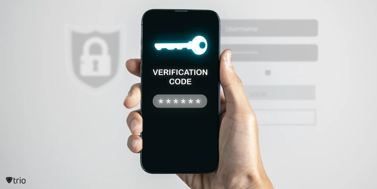A hand holding a phone showing verification and a passcode