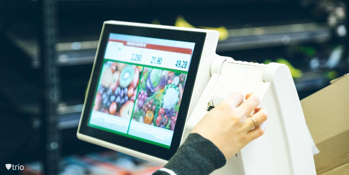 a woman taking a receipt after weighting the products