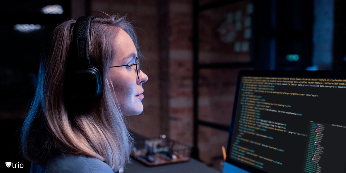 female software engineer looking at code