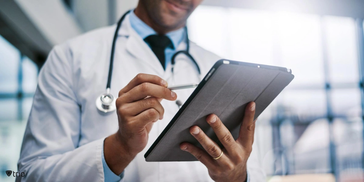 Doctor using tablet and pen in hospital