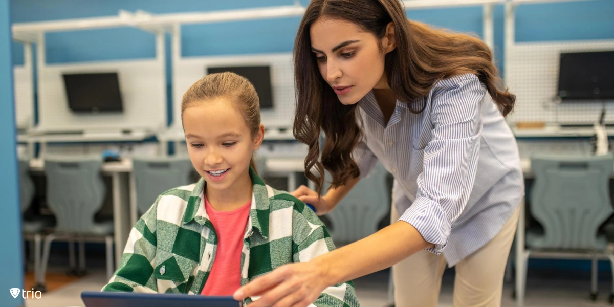 Teacher using iPad management software for schools on a student’s tablet