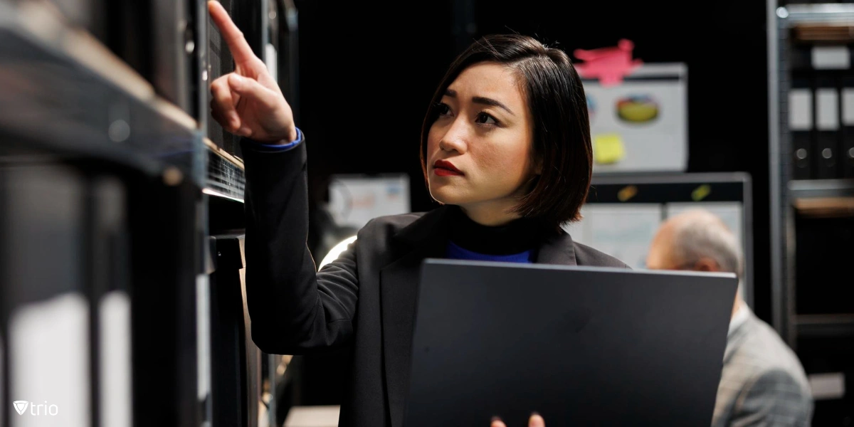 Woman using laptop to create cybersecurity for small business