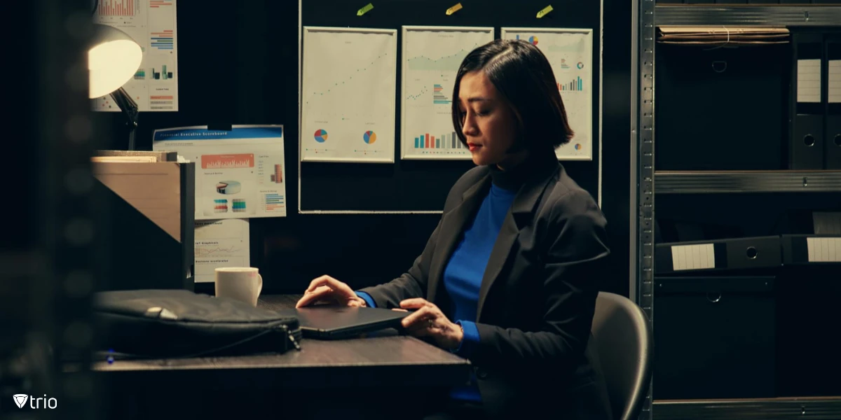 An IT professional opening her laptop to study the data gathered for the security audit