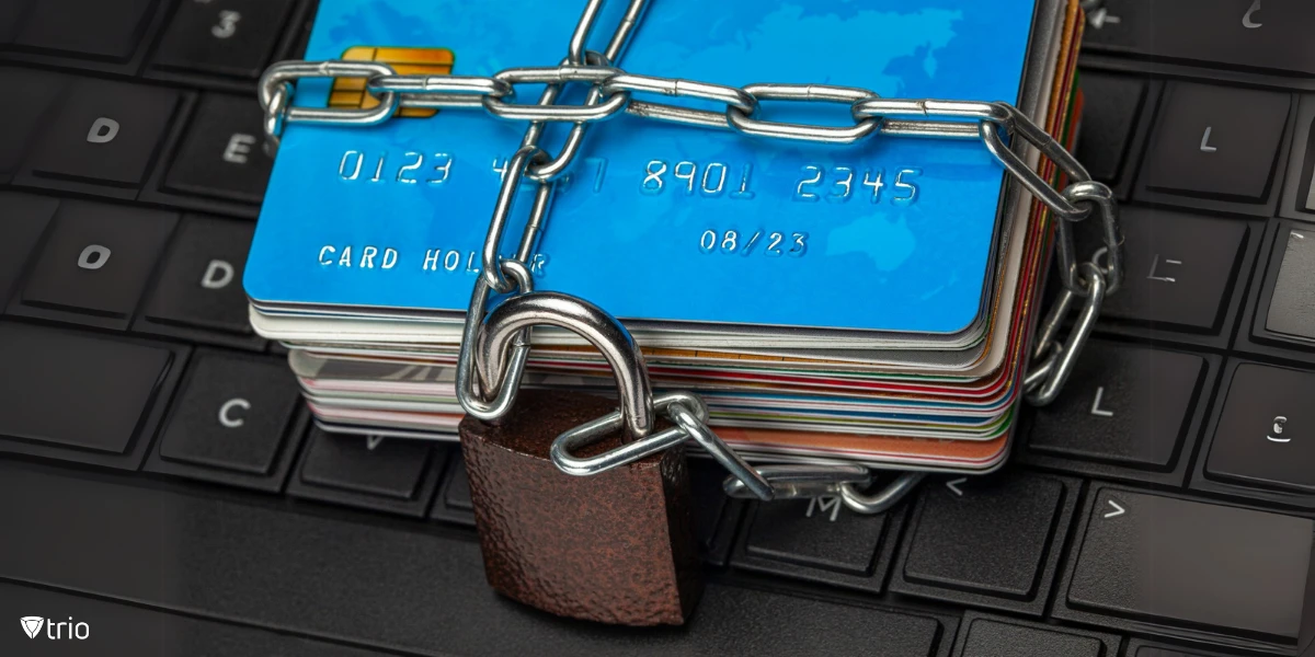 A stack of credit cards and a padlock with a chain and lock