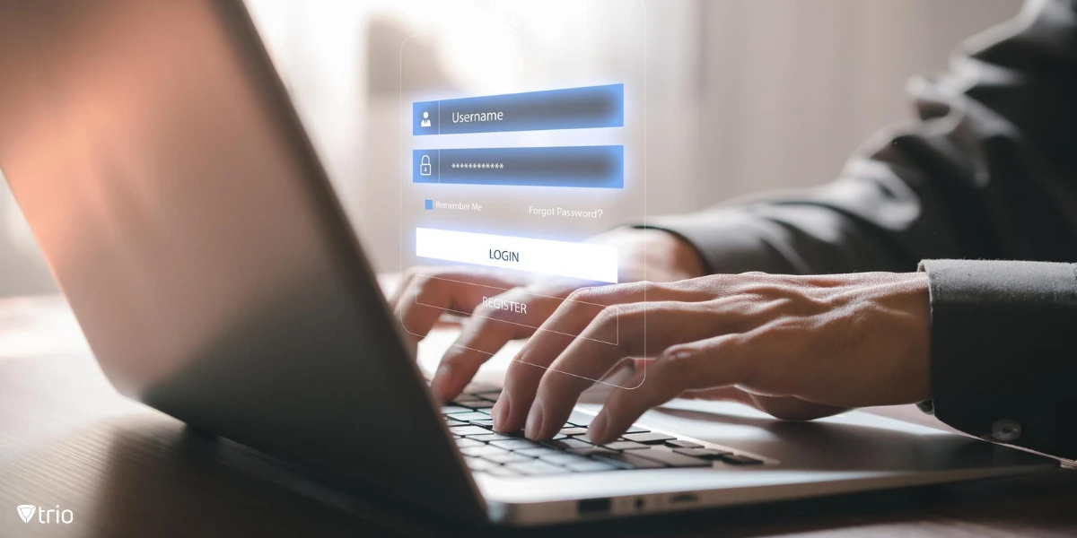 Hände eines Geschäftsmannes, der einen Laptop benutzt, aus dem der Anmeldebildschirm herausspringt