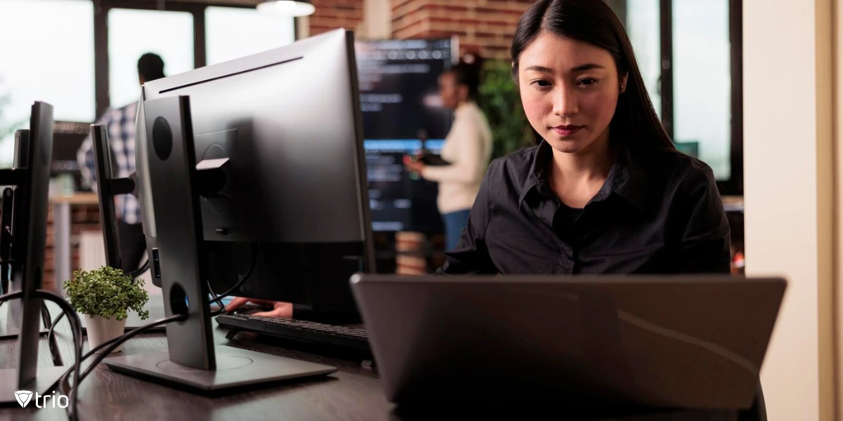 Woman sitting at desk table in IT company