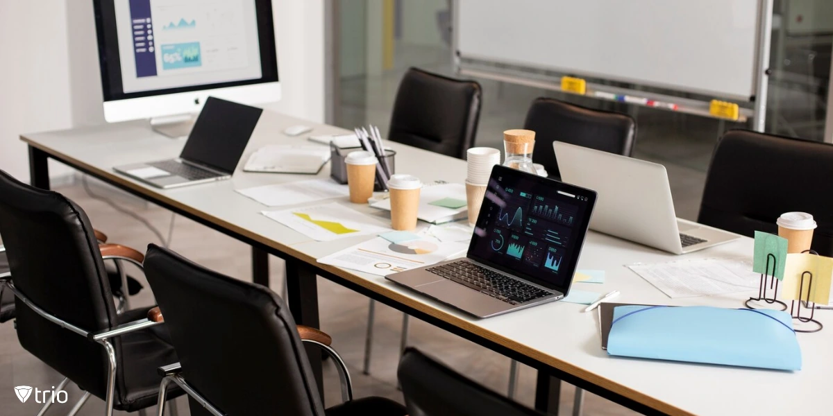 An office with multiple laptops on a desk
