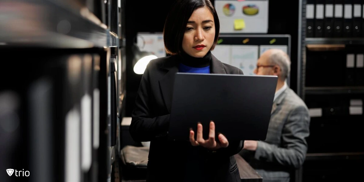 Portrait of a woman using a laptop at the office