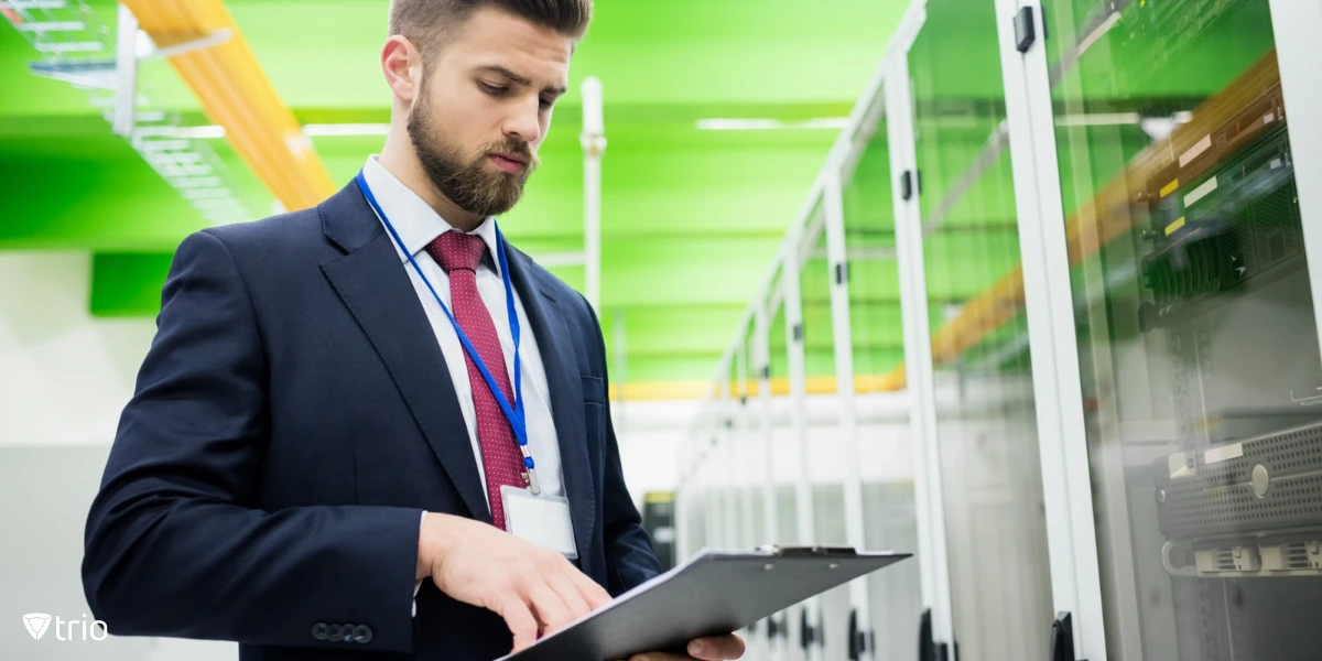 IT admin standing with tablet in office