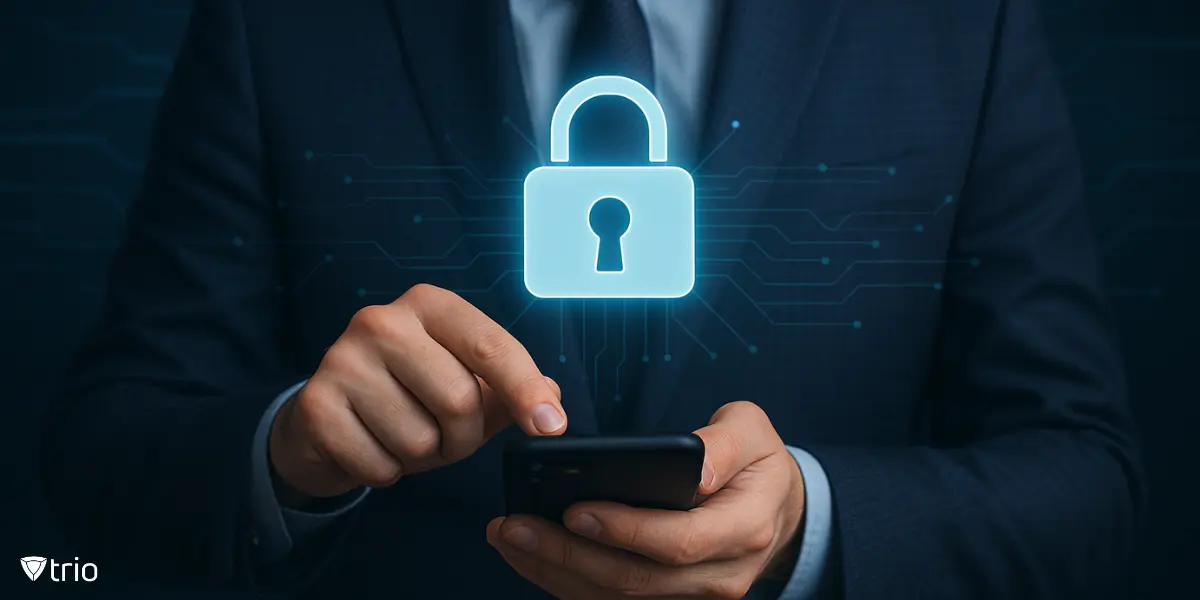 Businessman using smartphone with digital lock icon overlay, representing enterprise identity and access management security.