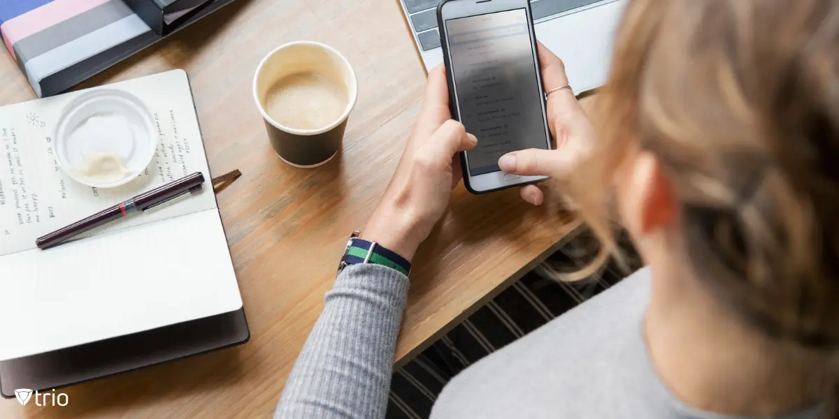 Woman using iPhone in office